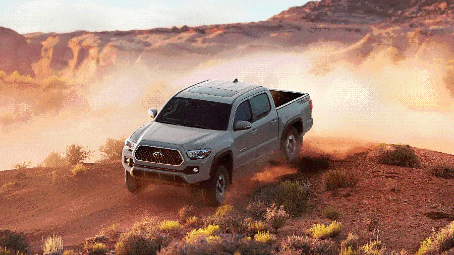 Stock image of the mighty and capable Toyota Tacoma in rough terrain