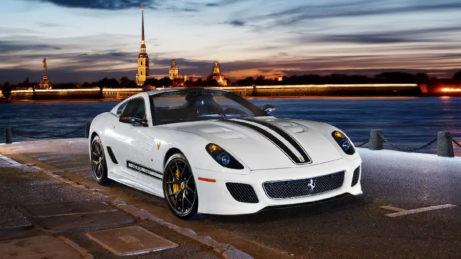 Download a lovely background image of a white Ferrari on the beach in pure quality suitable for tablets