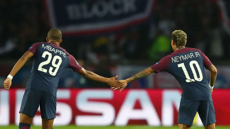 Neat background of Neymar and Mbappe bending down and holding hands