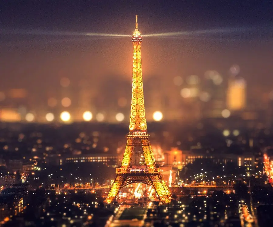 High quality stylish computer background of the golden Eiffel TowerAt Night in Paris, the French Cultural Center