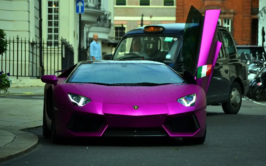 Beautiful photo of a purple Lamborghini with open doors for desktop