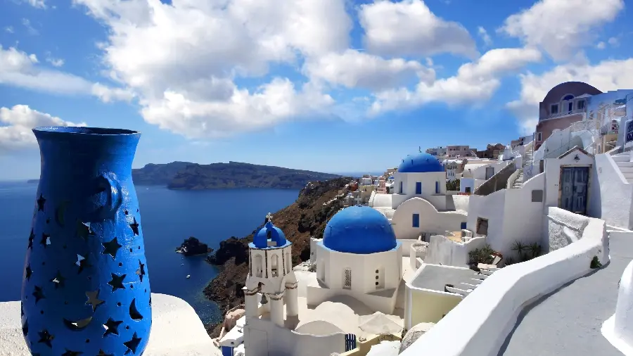 Stock photo of a blue pottery and part of the lovely buildings of Santorini