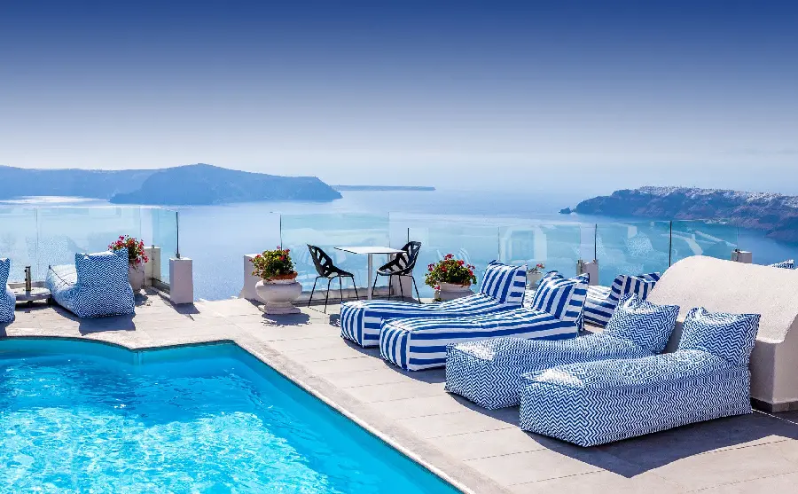Stunning stock photo of Santorini hotel sunbeds and pools