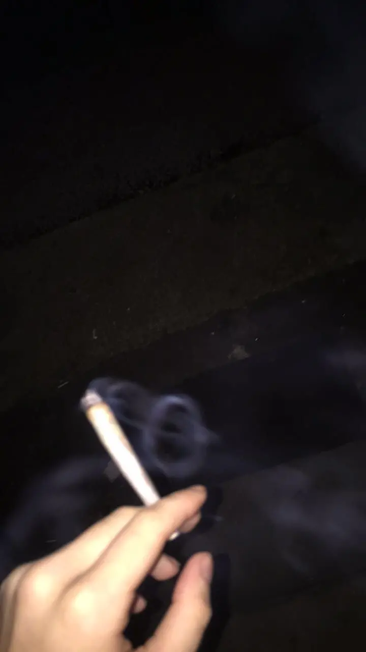 Interesting photo of a cigarette in hand for Instagram story 