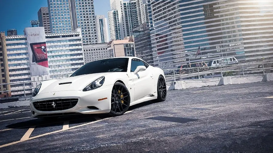 Amazing background picture of a Ferrari White color first class in front of buildings