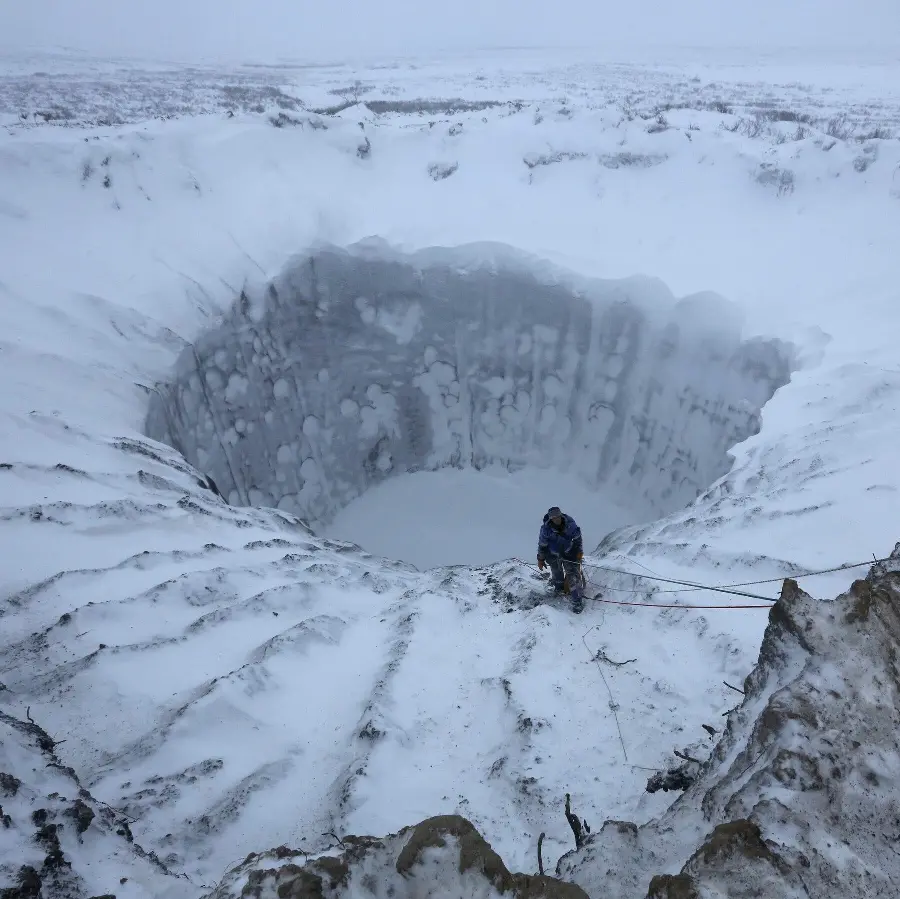 Amazing background photo of a huge snow pit in Siberia