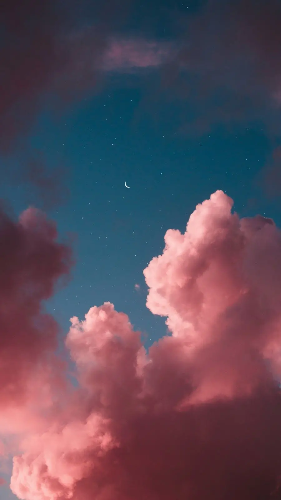 A cute background image of a metallic indigo blue sky and pink clouds and a beautiful crescent moon in hd quality