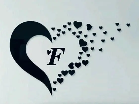 The most beautiful Romantic background image of F between a heart and small hearts next to it suitable for social networks