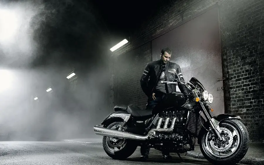 Background image with a special pose of a black motorcycle rider in pure quality suitable for tablets