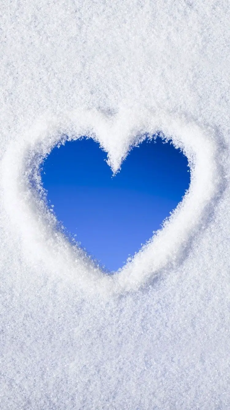 Download a cute heart in the snow wallpaper with a blue and white theme and 8k quality