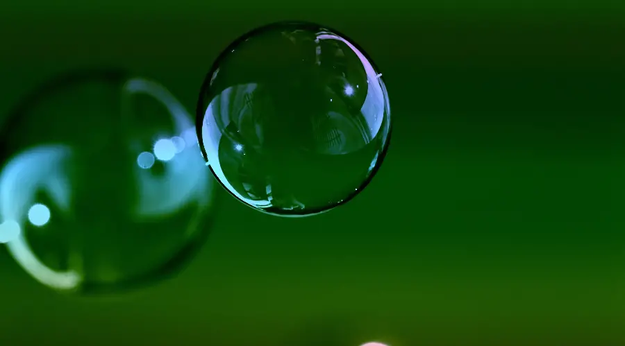 A magnificent background of bubbles in a green colored space with HD quality