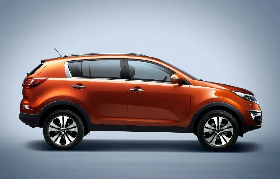 Side view of the orange Kia Sportage in HD quality