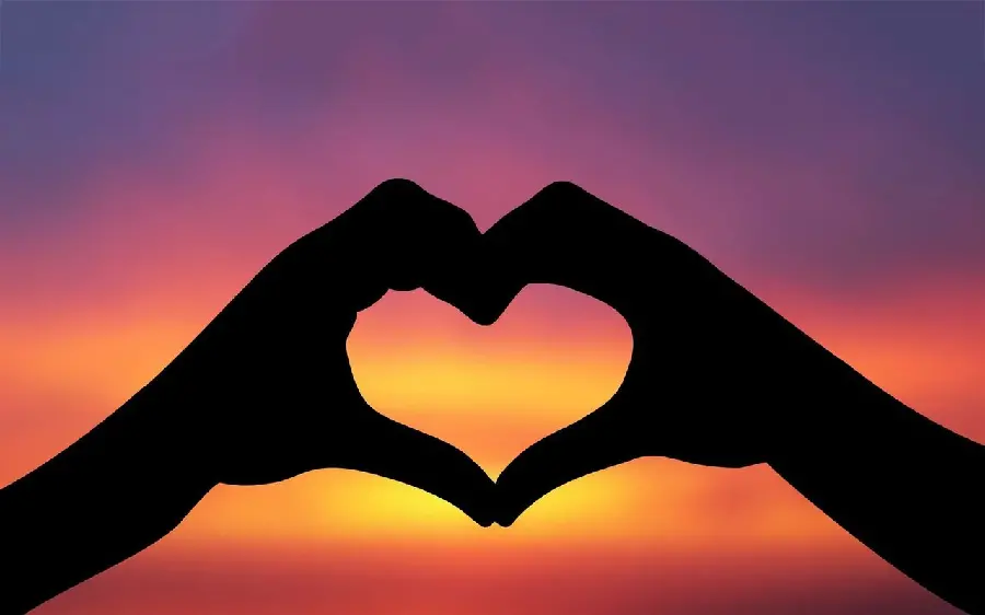 Download Dreamy Wallpaper Heart with Hand at Sunset for Desktop in HD Quality