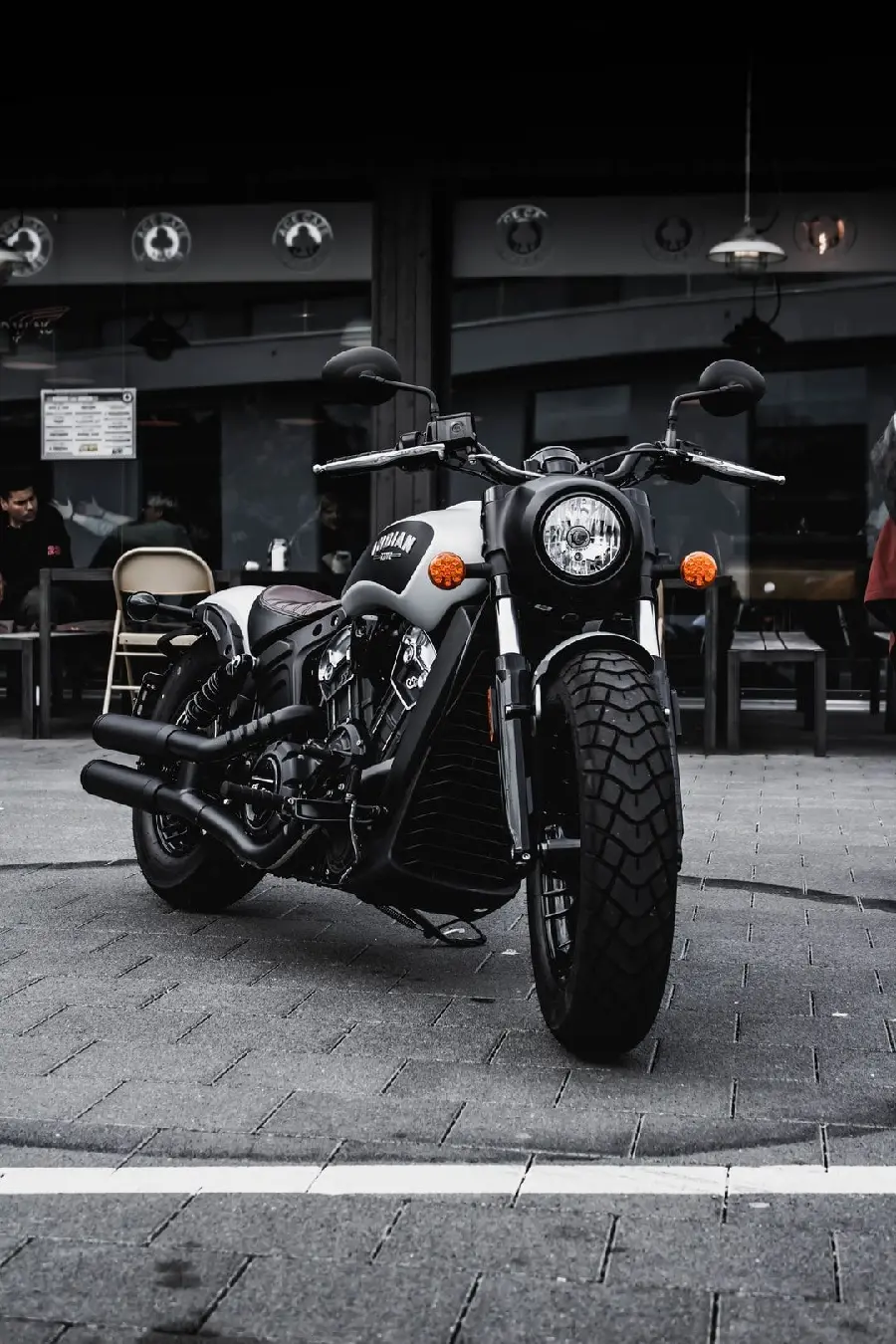 Image Popular black motorcycle in front of a coffee shop special smartphone hd quality