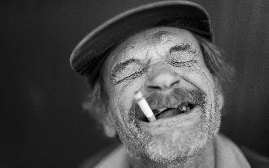 Famous photo of a smiling old smoking man for Instagram posts and stories 