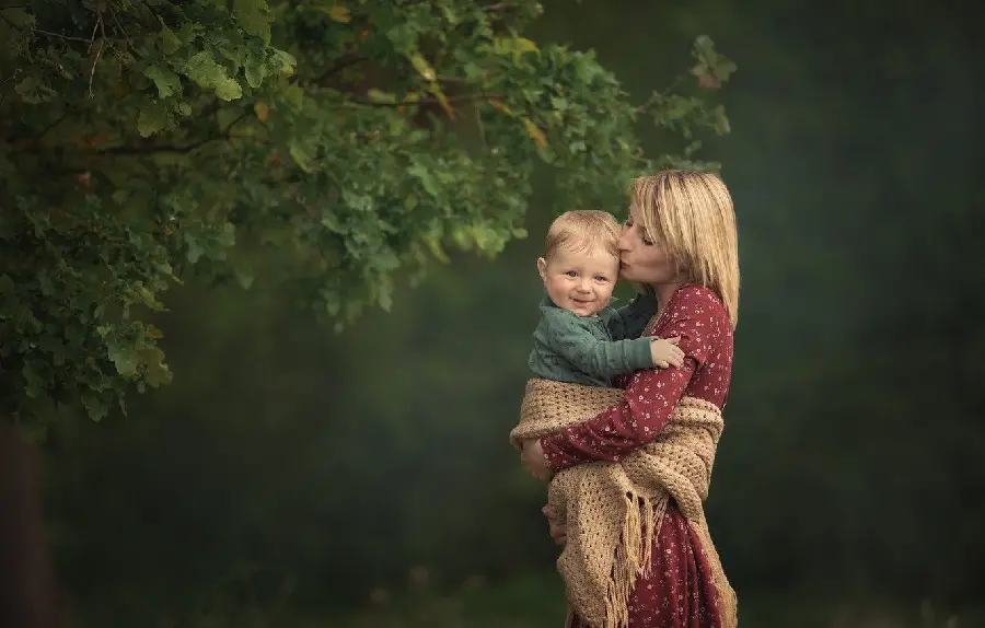 4K Dreamy Wallpaper of Mother and Baby in Lush Nature