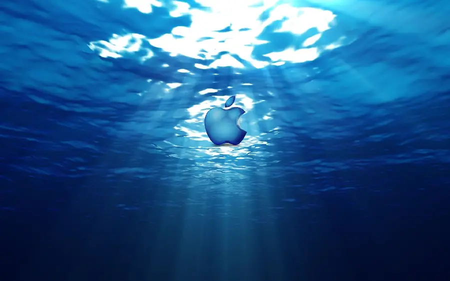 Download a picture of a bitten apple floating in clear water in HD quality