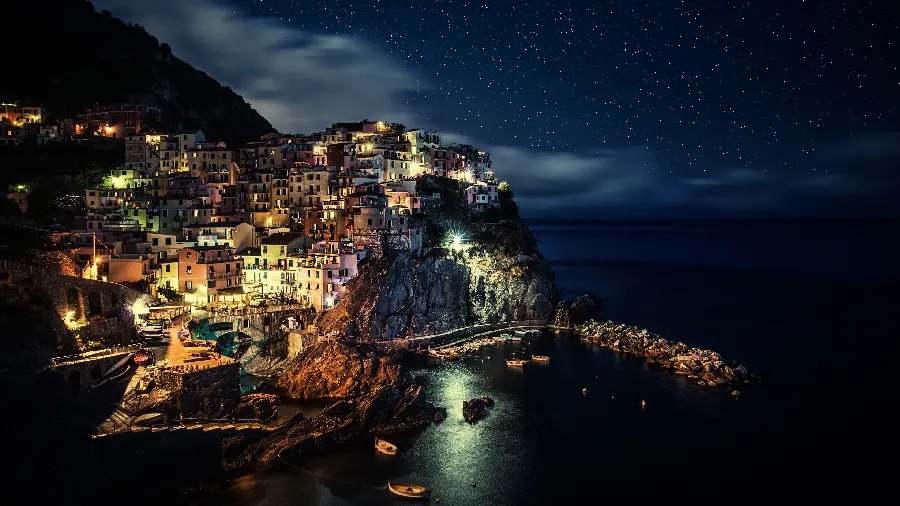 Download a stock photo of a dreamy island city full of stars at night with top quality suitable for Telegram