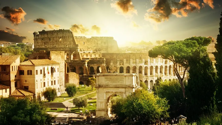 A dreamy wallpaper of the spring landscape of the Colosseum and the old buildings around it