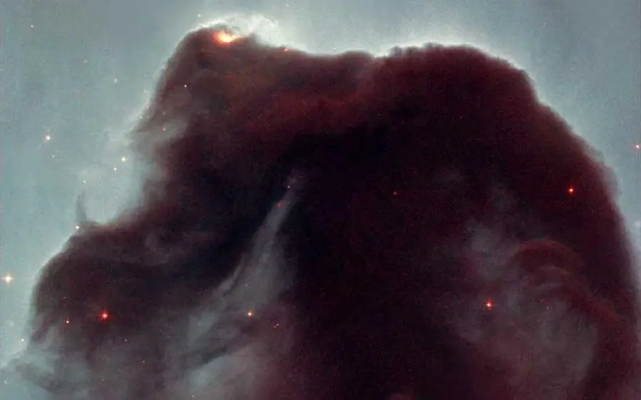 Unclear and strange stock photo of the Horsehead Nebula on a gray background