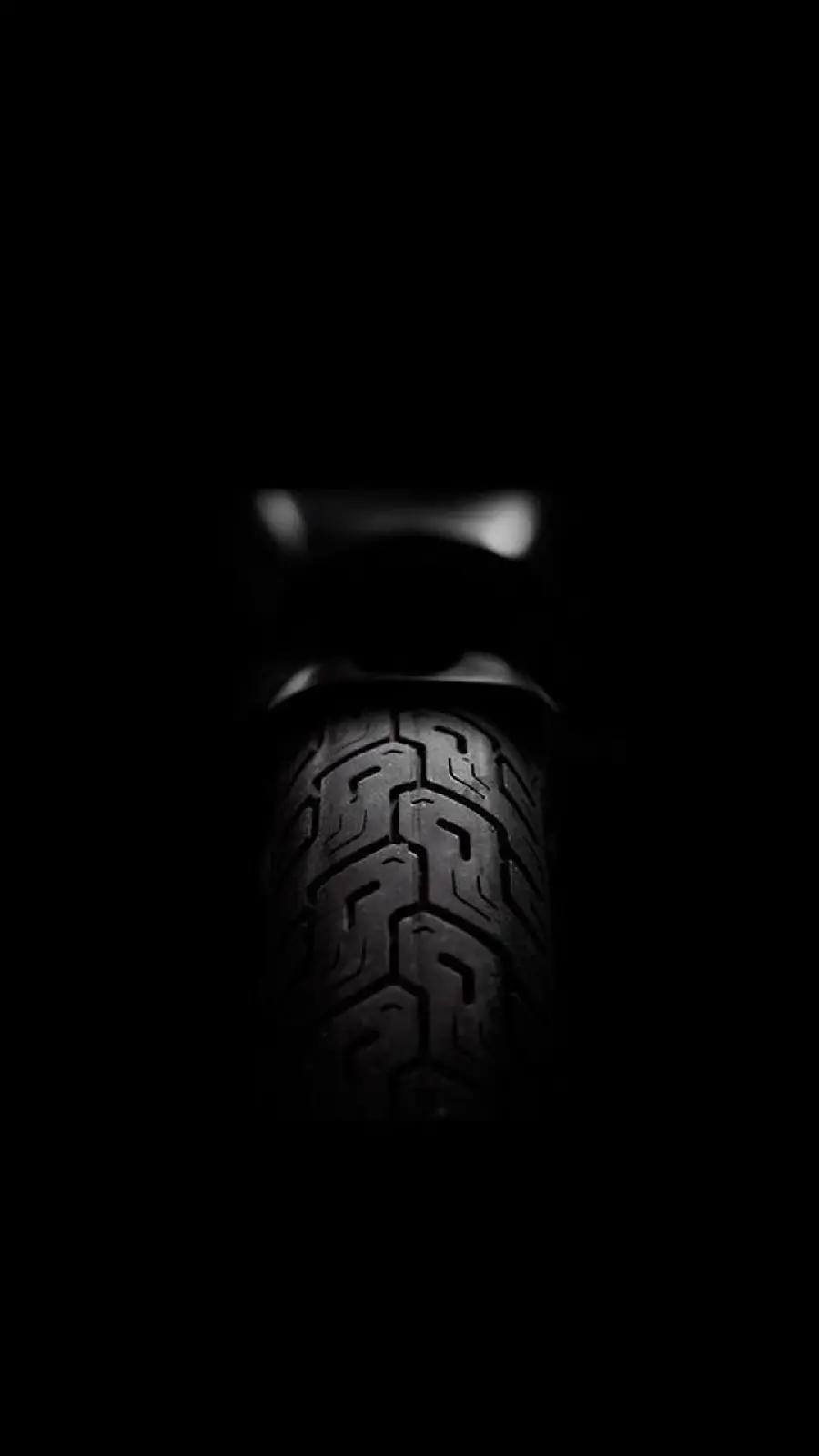 Unknown and dark stock photo of tireBlack Motorcycle
