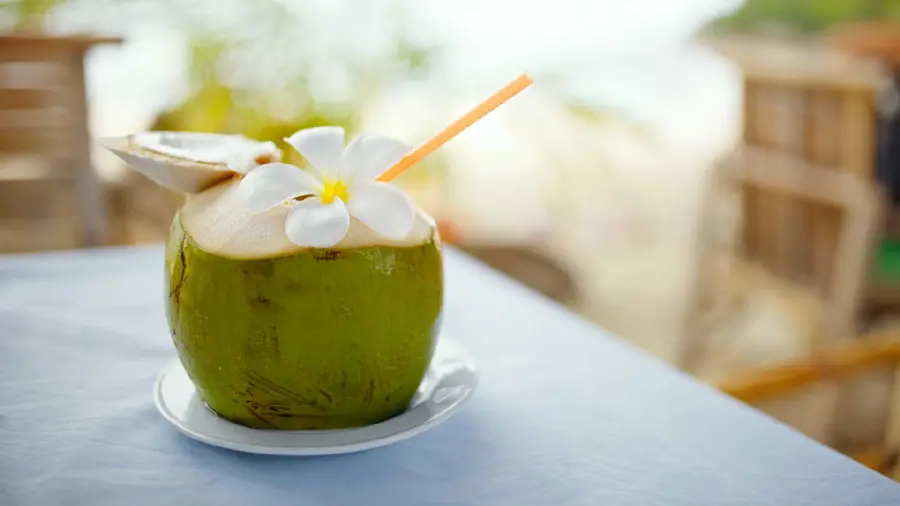 Dreamy stock image of a green coconut with beautiful flower decoration in HD quality for Windows