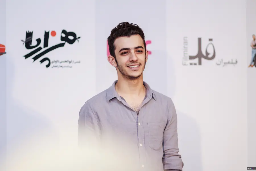 A picture of Ali Shadman with a sweet smile, suitable for a background