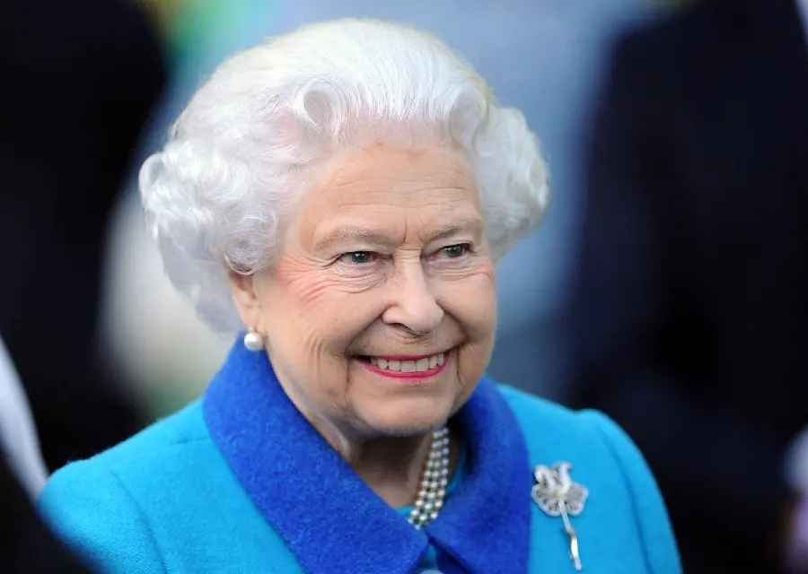 The late Queen of England with a famous smile in an interesting frame 