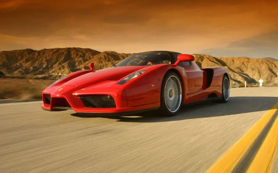 Unique Ferrari Enzo background at high speed on a mountain road