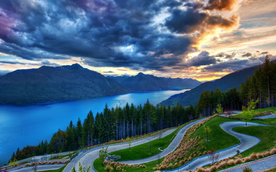 Sparkling view of a long road by the sea in New Zealand
