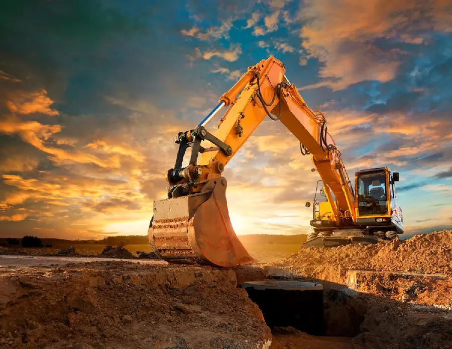 Photo of a huge yellow excavator digging 2022