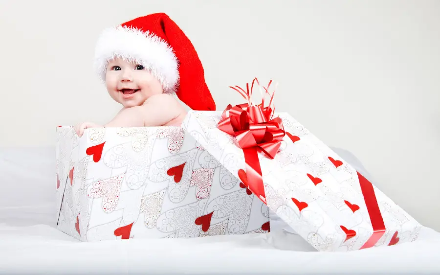Christmas Background with Little Baby in Gift Box