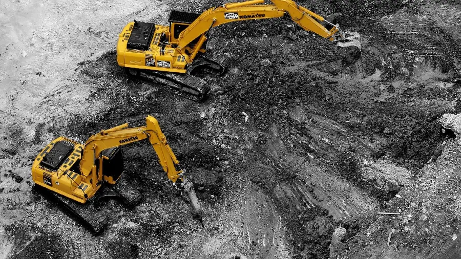 Download wallpaper of two yellow excavators at work