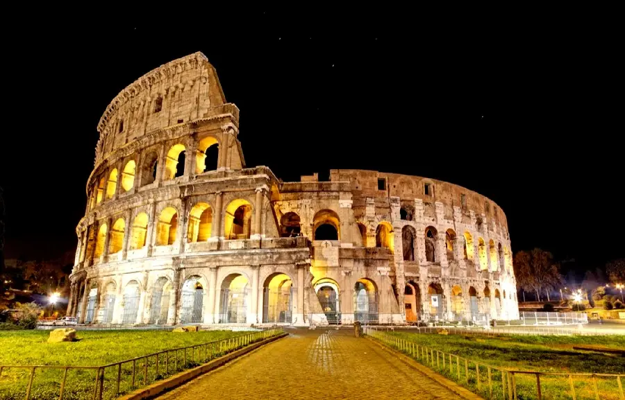 Lighted stock photo in the dark of the night from the Colosseum, the place where celebrations and sports competitions are held