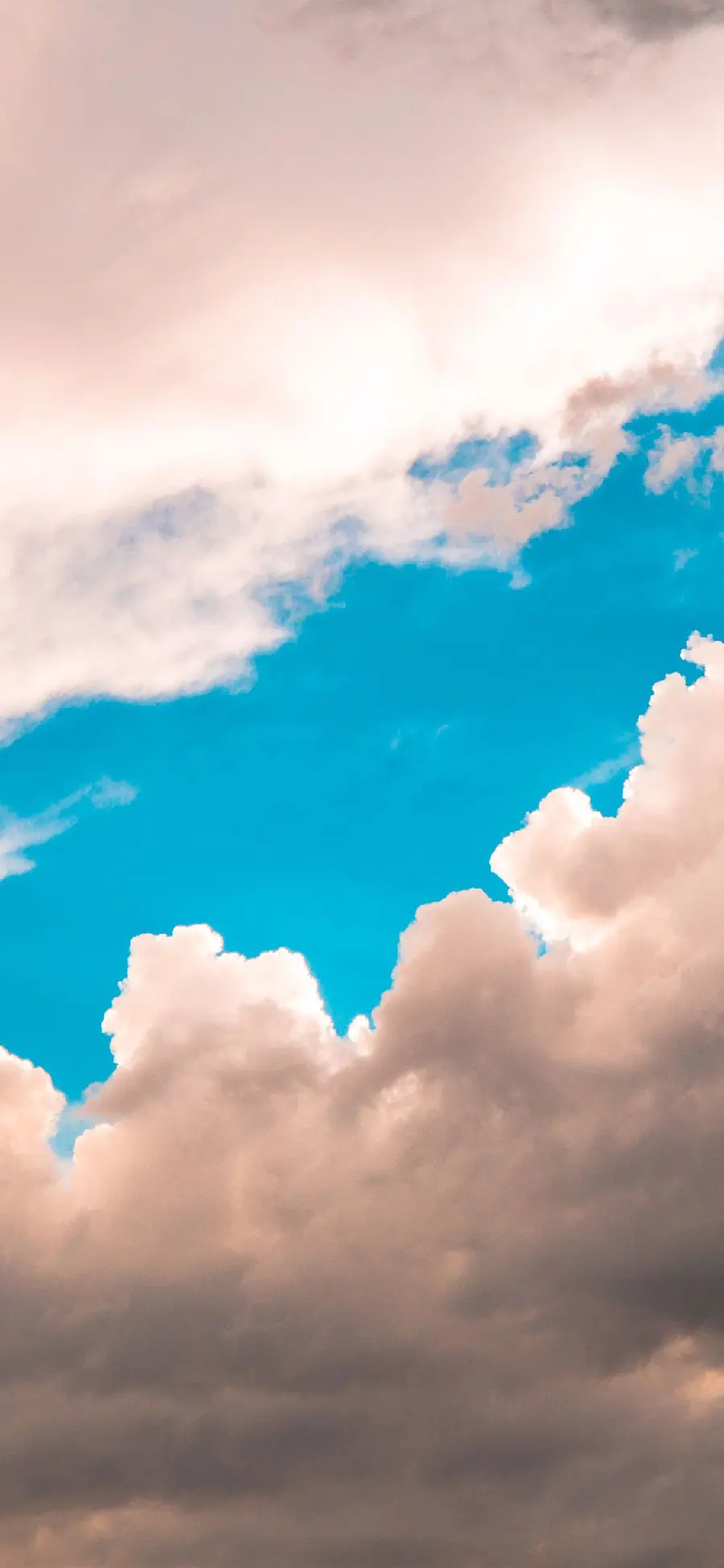 Download a clean and special computer background of a part of the turquoise blue sky between two parts of white clouds