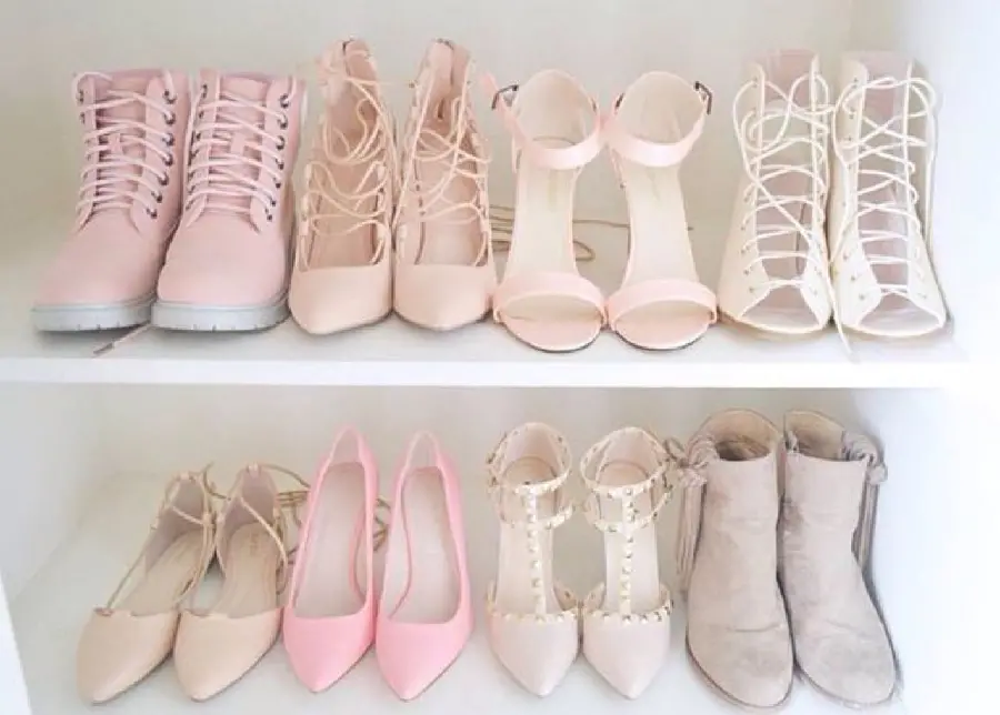 Interesting image of a girl's shoe closet with nude and pink colors 