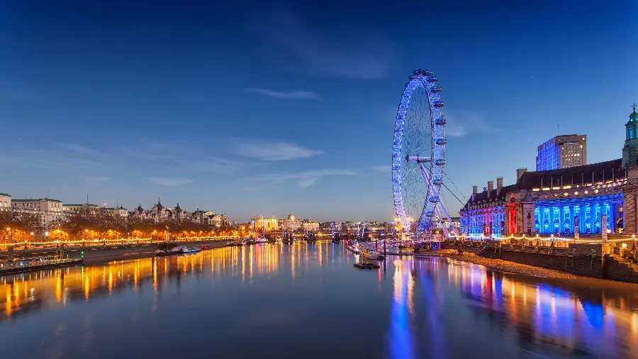 The most excellent background of the very beautiful Ferris wheel of the city of London at night in full quality