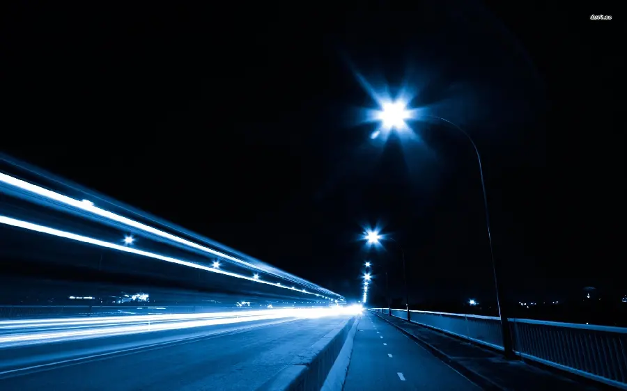New background for Windows 12 with a bright and beautiful road image at night