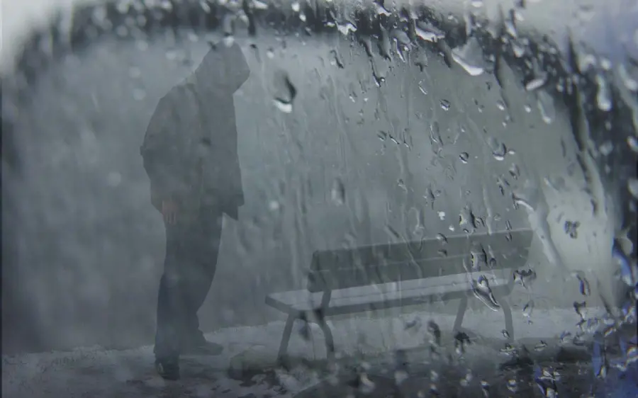 Download the background of a sad man in the rain with the best quality