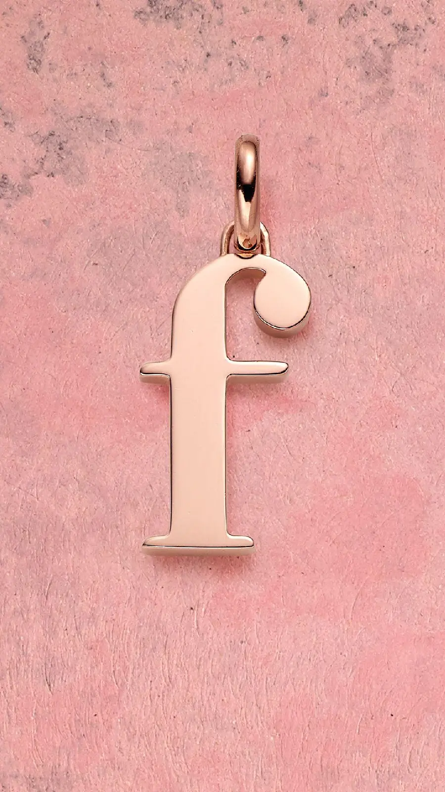 A beautiful bronze English single letter f profile photo on a pink background