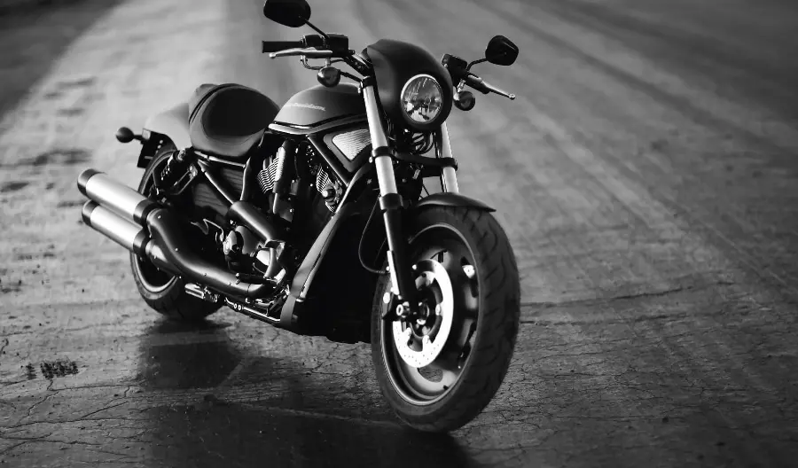 Download a black and white background image of a small black motorcycle in HD quality