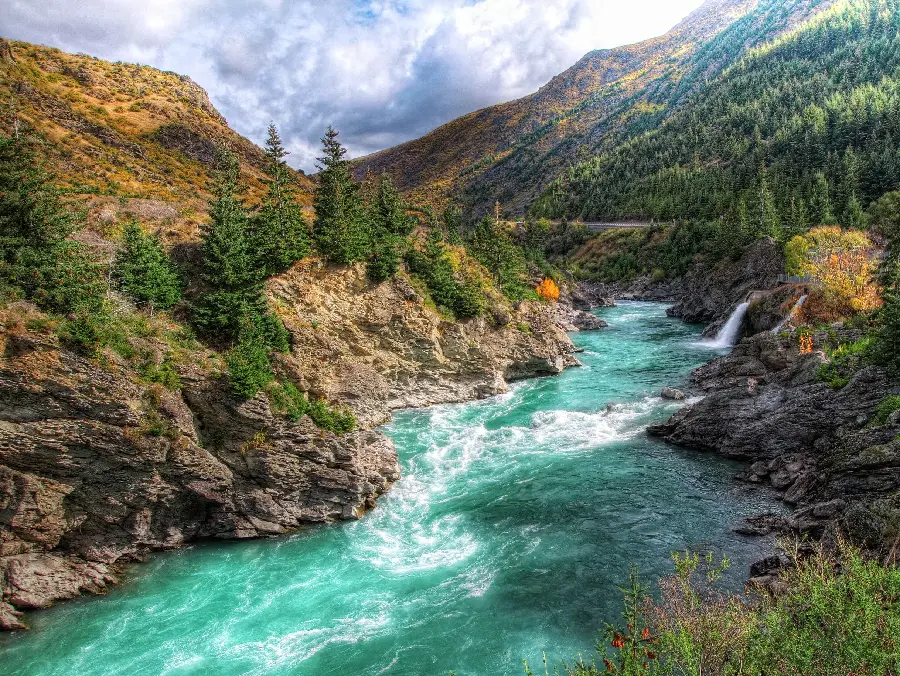 A fresh blue river in New Zealand nature in an artistic frame