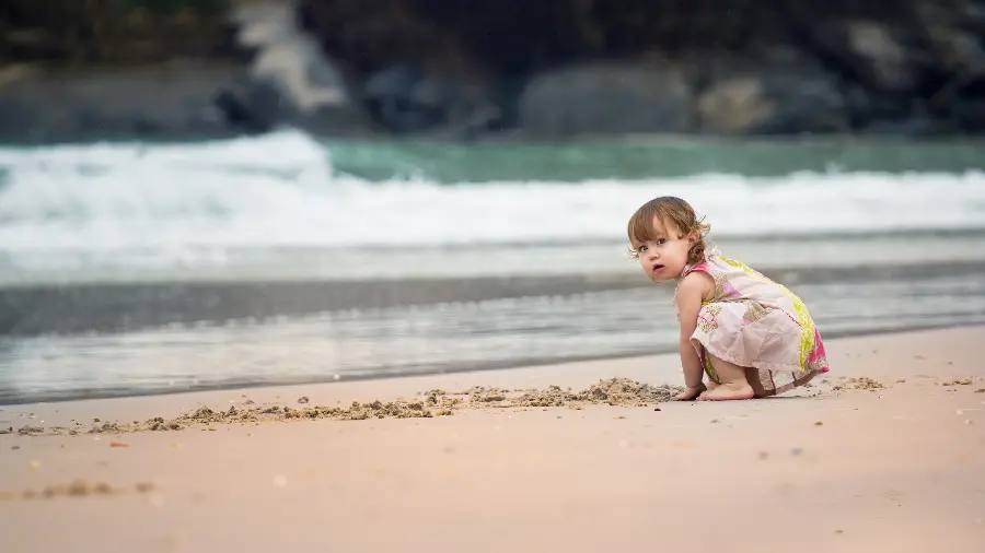 Cute Baby Playing on the Beach Background for Windows 12