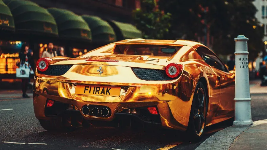 The most viewed photo of a golden Ferrari from behind in high quality
