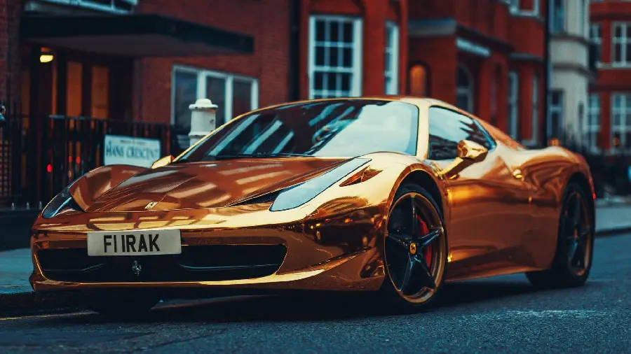 Interesting background of a beautiful golden Ferrari car for a laptop