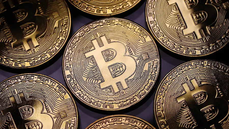 Fantasy background of gold coins with the Bitcoin logo for cryptocurrency lovers