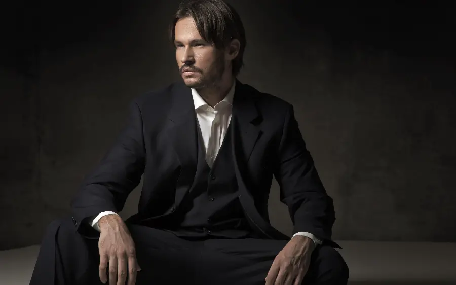 The most stylish foreign male model with a classic suit in an HD art frame 