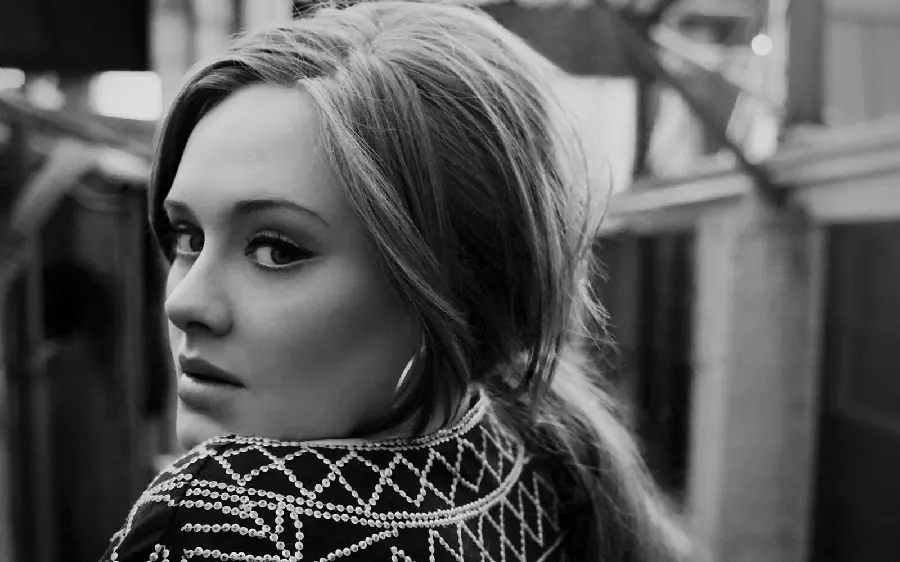 Stock image of an innocent and half-glanced back of the famous and beautiful British singer Adele