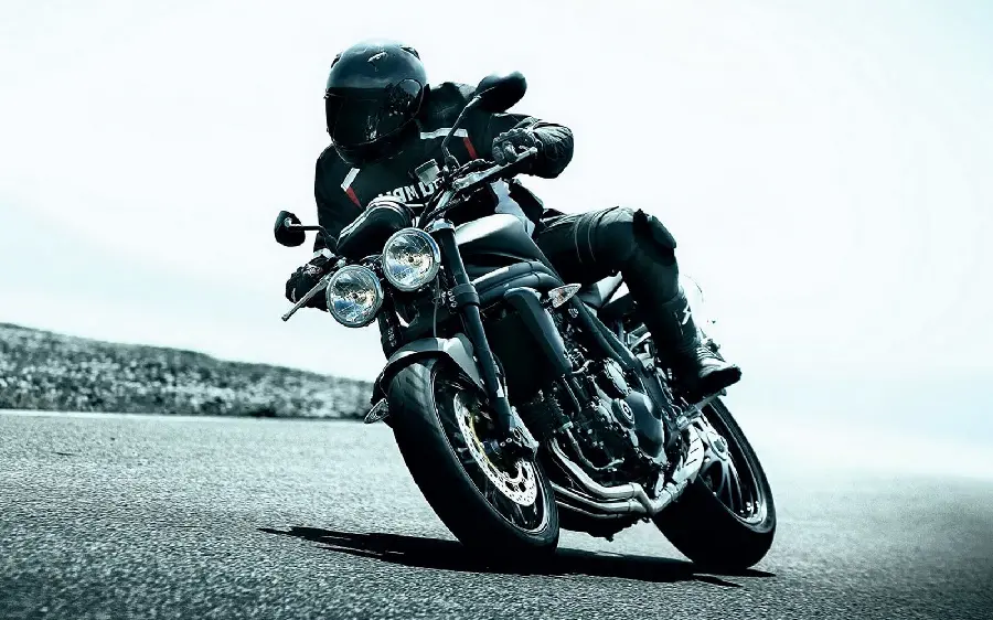 A creepy picture of a fast and powerful black motorcycle in HD quality