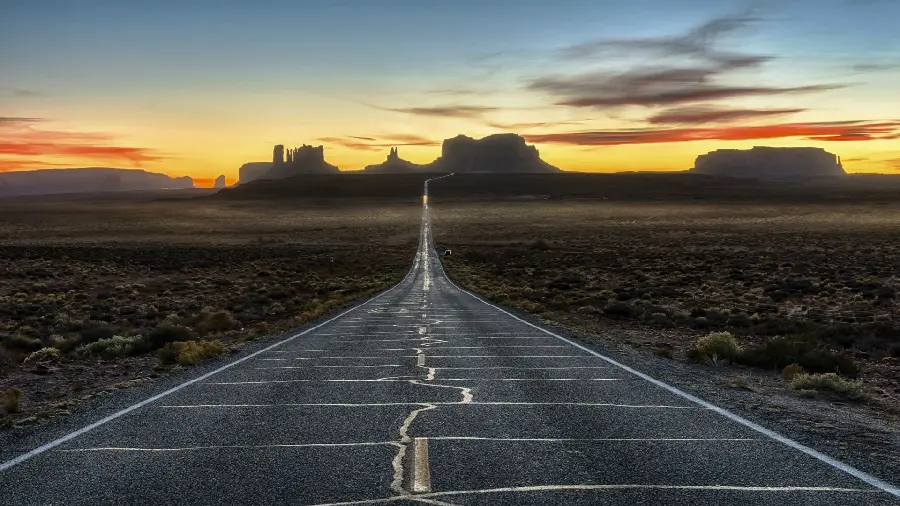 Background of sunset and shadow dominating the highway and valley of the Arizona desert